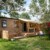 Mobil-home familial avec terrasse en bois dans un camping verdoyant en Occitanie