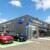 Façade de l'agence automobile Distinxion à Narbonne avec véhicules exposés.